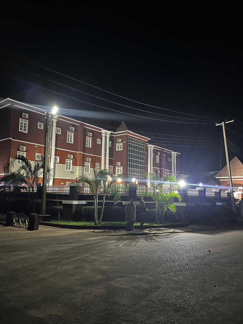 The hotel building lit up at night
