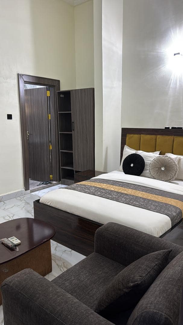 Business suite bed with wardrobe and armchair