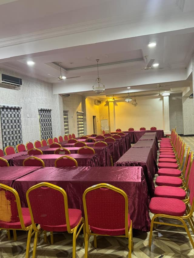Conference hall seen from the entrance toward the front wall