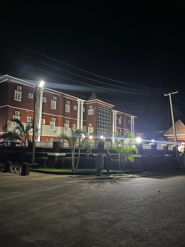 The hotel building lit up at night