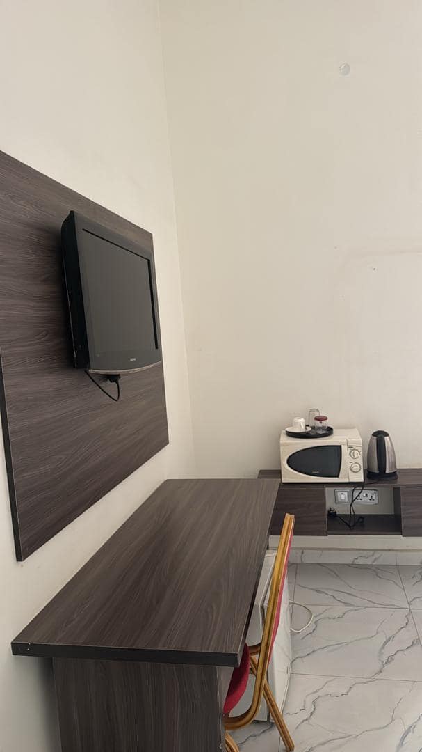 Superior room with wall-mounted TV, desk, microwave and tea station