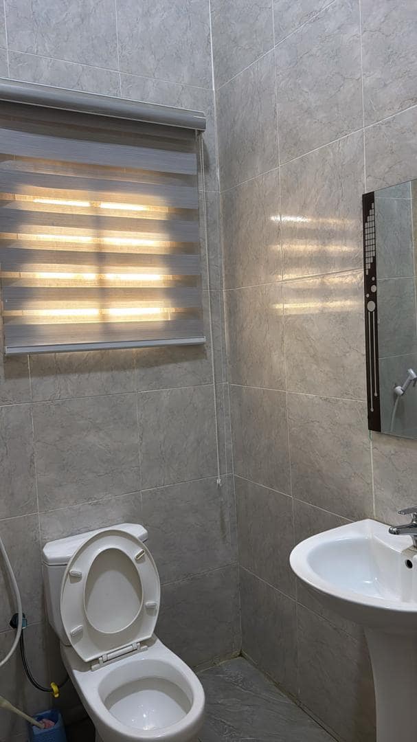 Superior room bathroom with toilet, basin and mirror